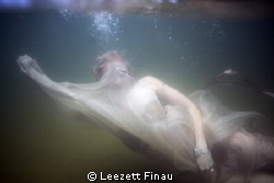 I captured this image of a bride during a drown the gown ... by Leezett Finau 
